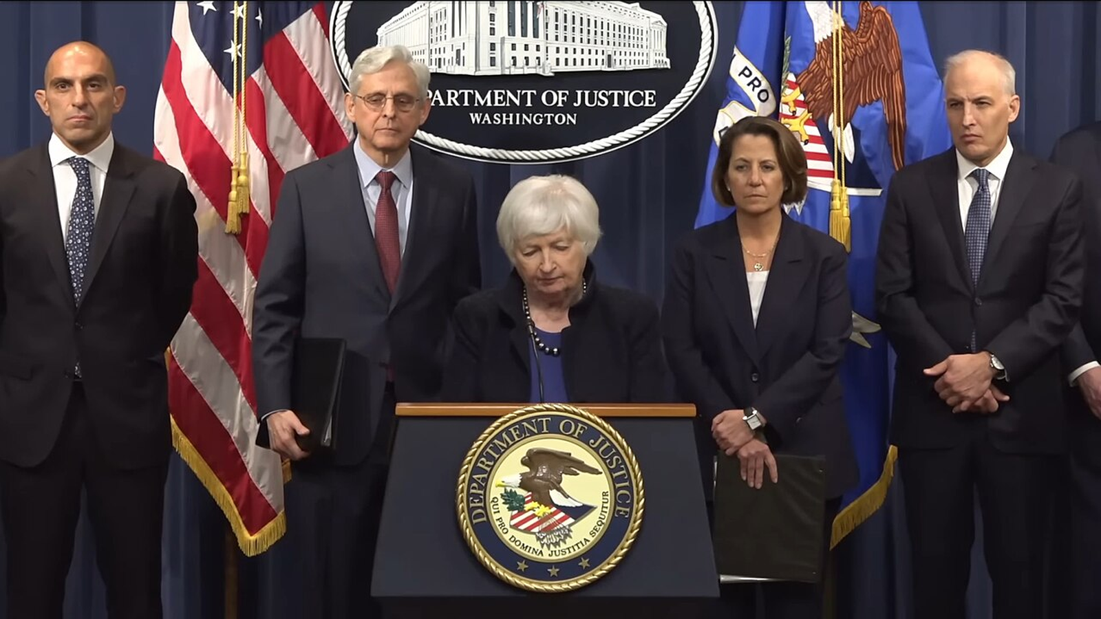 U.S. Department of Justice officials at a press conference announcing Binance guilty pleas